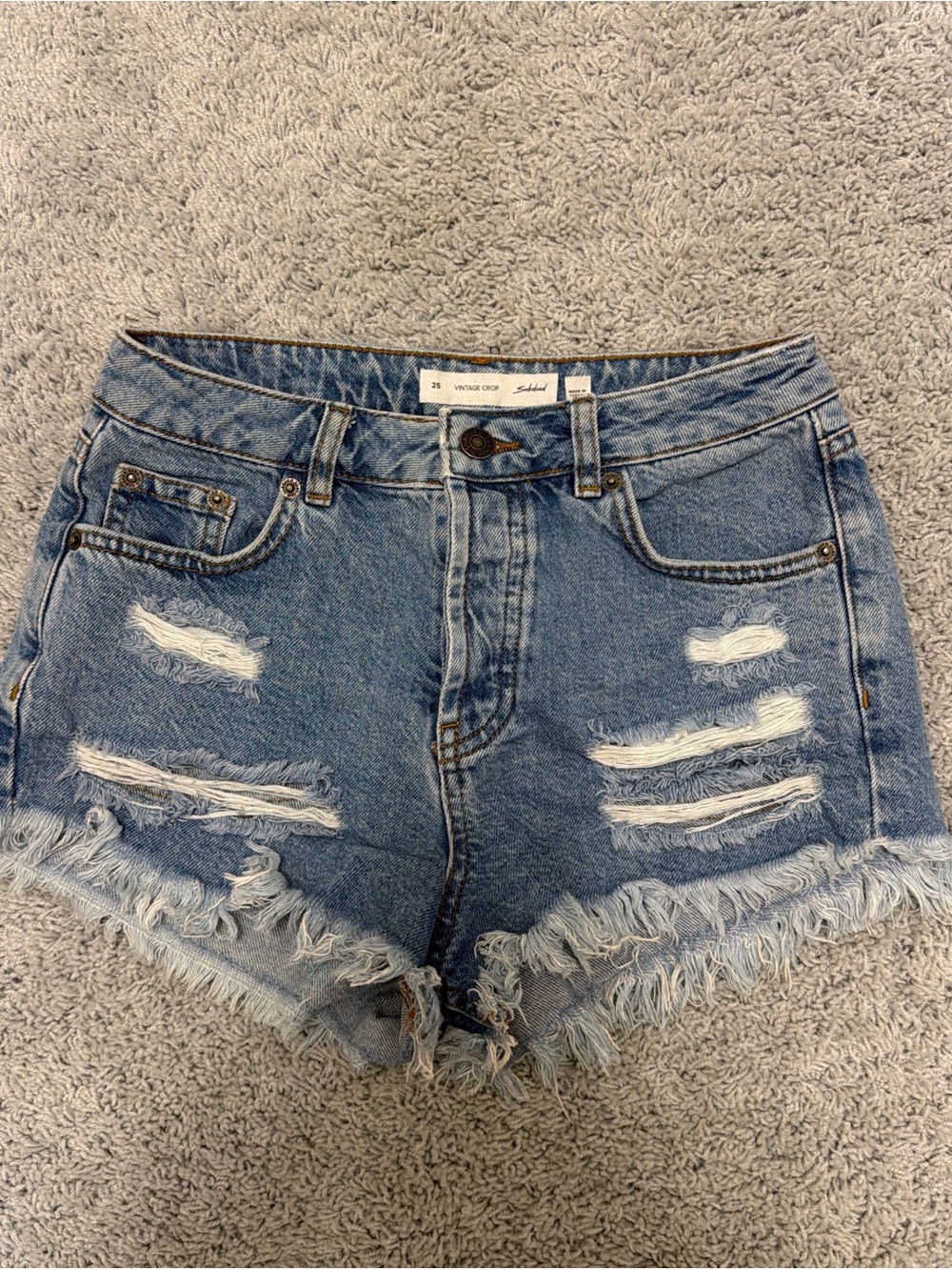 High-Rise Distressed Denim Shorts in Blue - Unlabeled